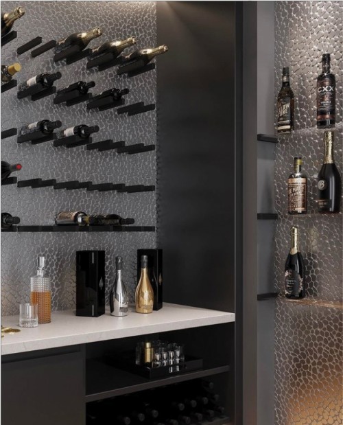 Metal pebble tile from MirMosaic finishes off this beautiful bar