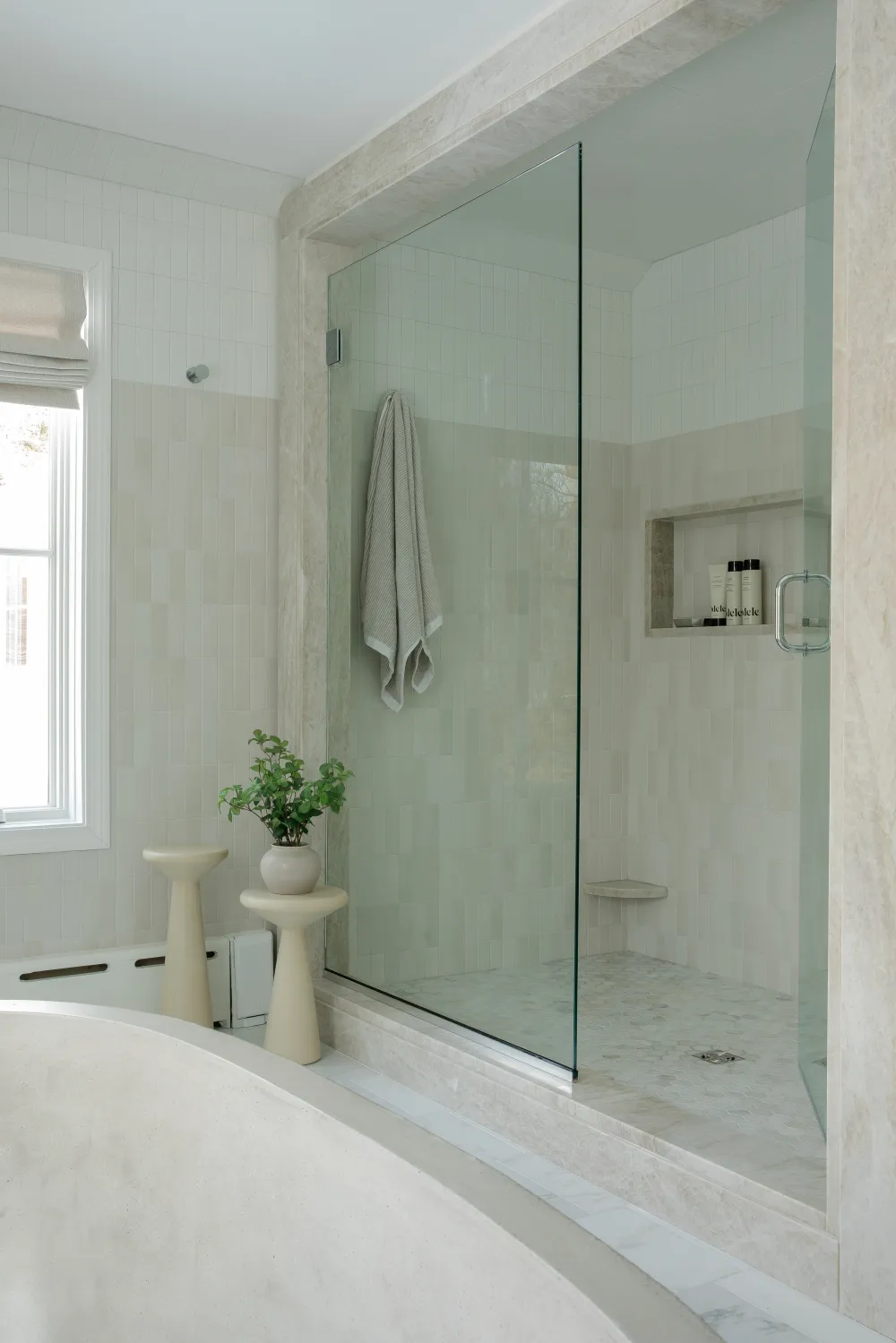 Bathroom with white tone tile with Beige accent, shown in a real tile project