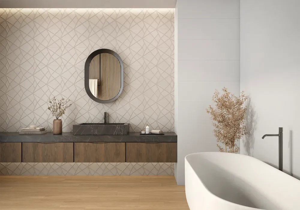 Modern bathroom vanity featuring Origami Art Vison textured geometric tile feature wall behind a dark marble trough sink and wood floating vanity.