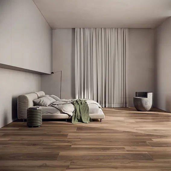 Minimalist primary bedroom showcasing rich walnut-toned Oak Lane Noce wood-look porcelain floor planks in a running bond pattern.
