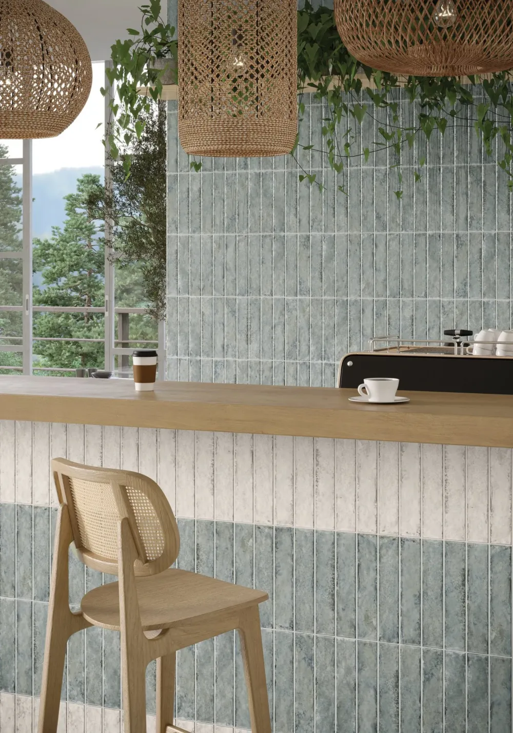 Commercial coffee shop featuring vertically stacked Organic Clay Mercury sage-blue and Steam off-white slim tiles on the bar facade and wall.