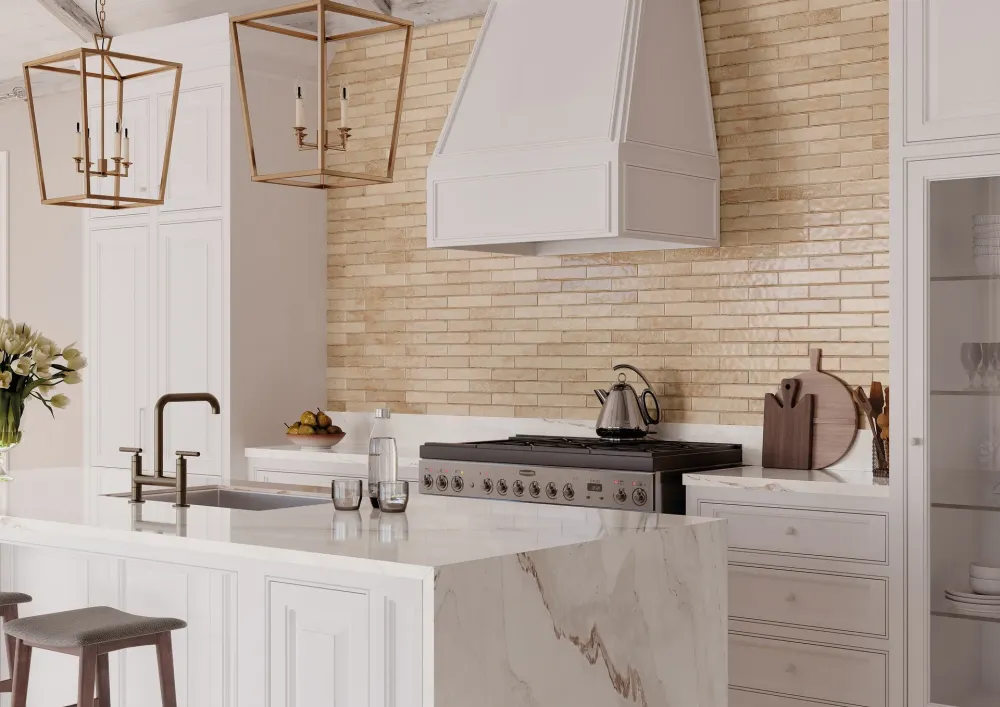 Luxury kitchen highlighting Organic Clay Sand slim, textured sandy-beige subway tiles as a full-height wall backsplash behind the cooking range.