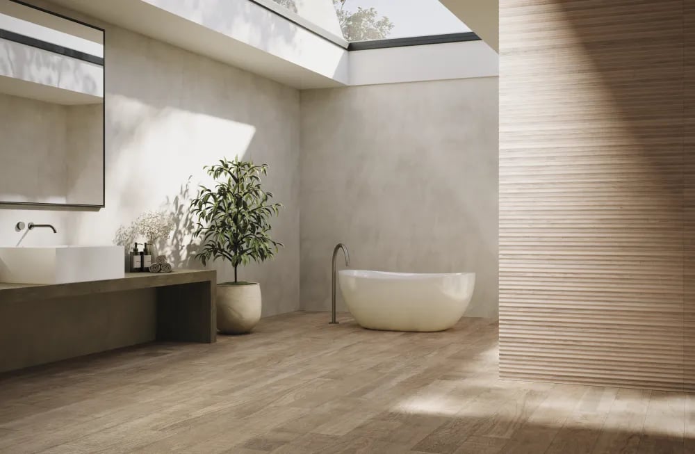 Minimalist spa bathroom featuring Arca Nordic wood-look porcelain floor planks and a 24x48 Covesso fluted accent wall beside a freestanding tub.