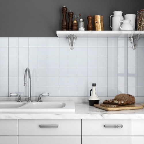 Subway & Picket Collection back splash in white with kitchen sink and shelf.