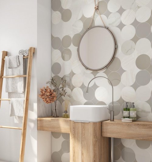 Bathroom wall with circular tile in different neural tones by Audrey Lane