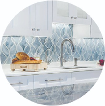 Light blue Artistic Kitchen backsplash white cabinets