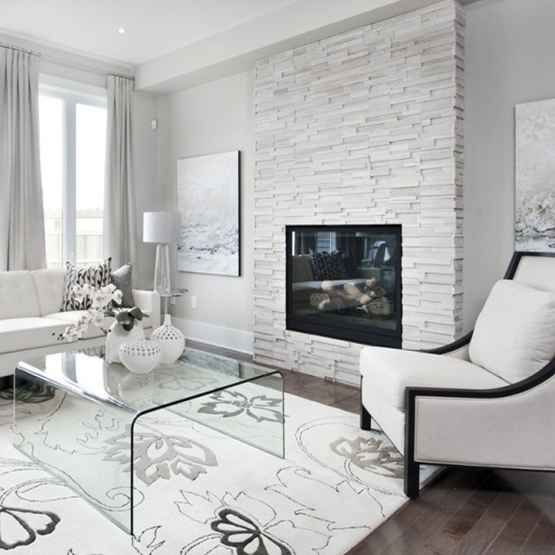 Living room fireplace surrounded with white natural stone tile